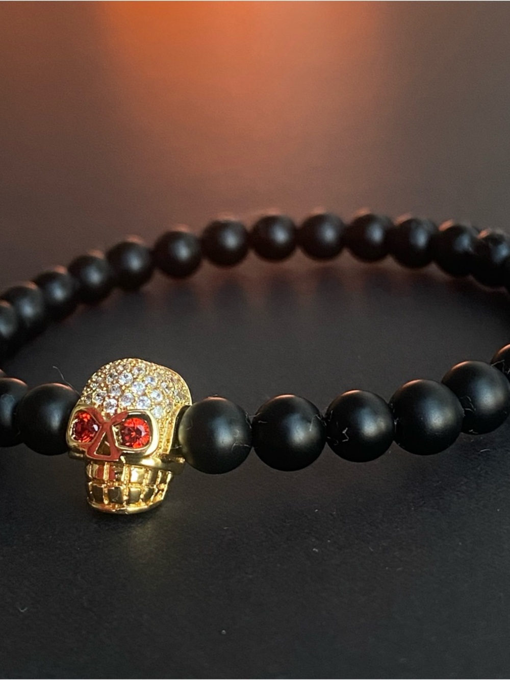 Howlite Beaded Bracelet with Gold Skull and Red Crystal Eyes